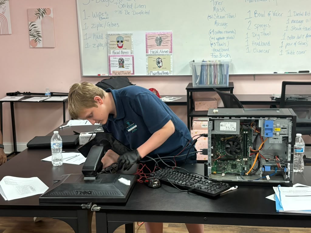 Students practicing safe network setup and basic terminal configuration on laptops